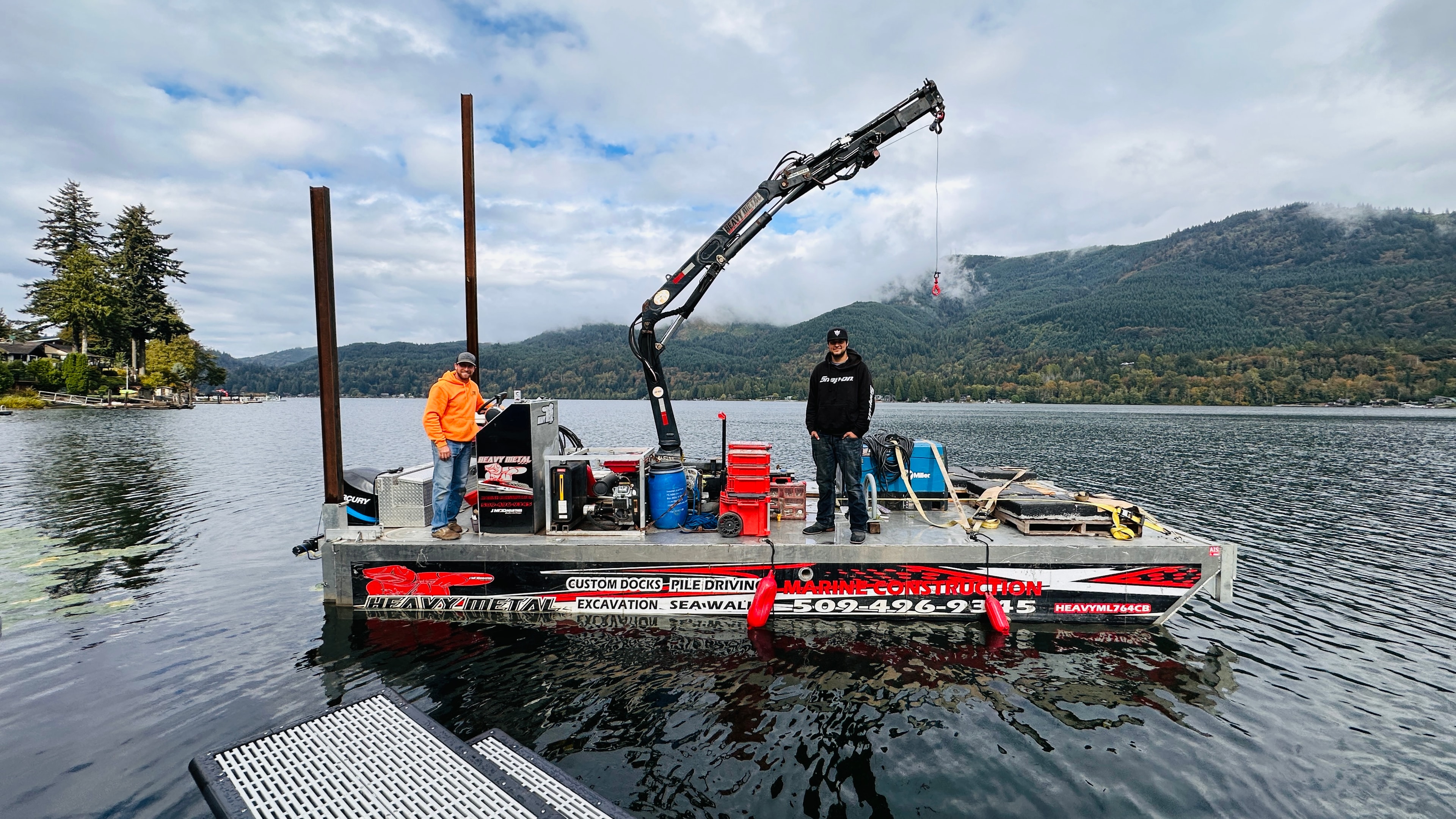 Heavy Metal marine construction barge and crew at work on a PNW lake