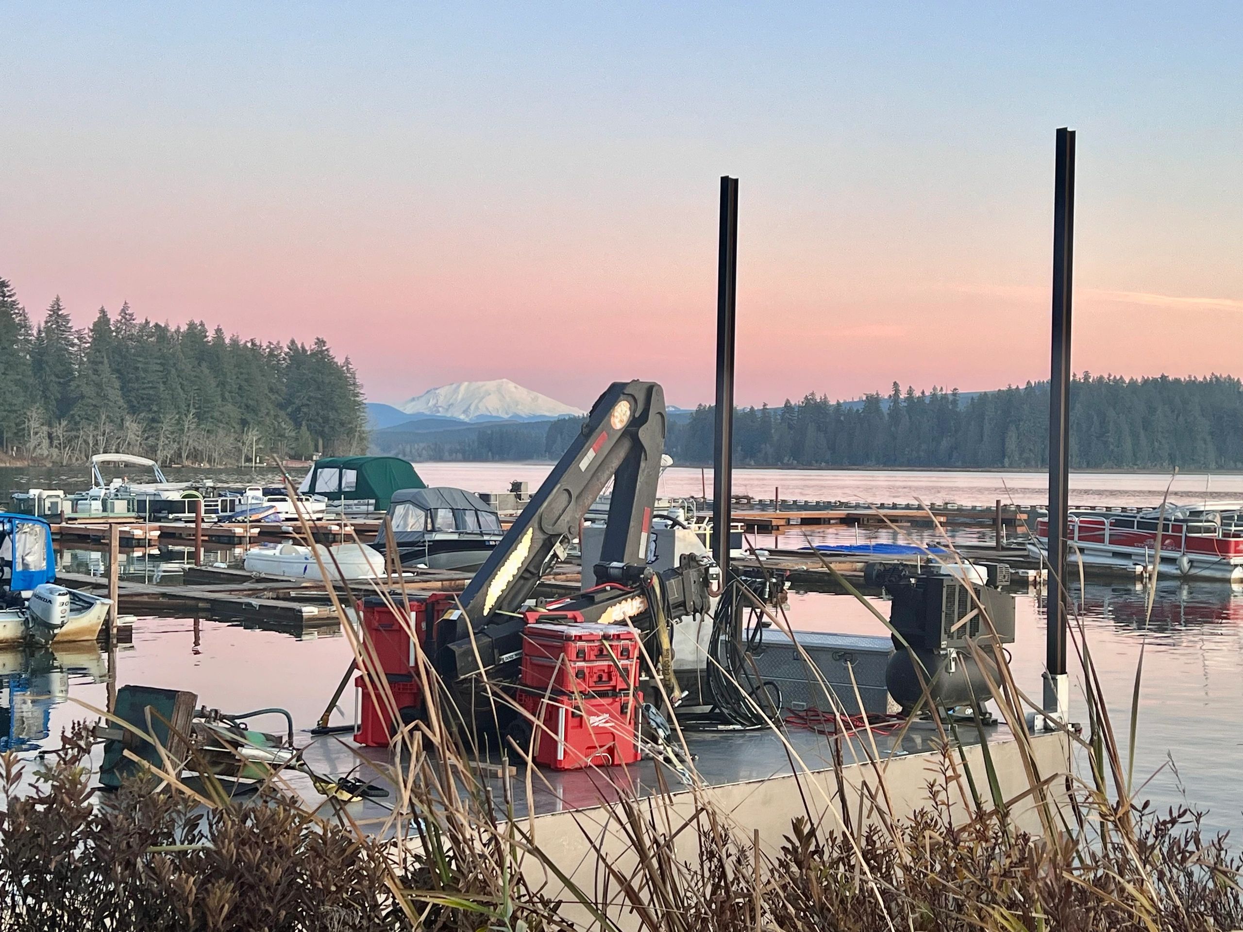 Heavy Metal marine construction barge and equipment on PNW waterfront